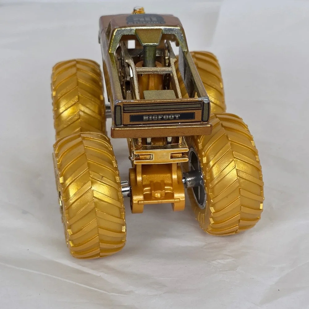 Hot Wheels Monster Trucks Bigfoot 4x4 50th Anniversary Gold 1:64 Scale Die-Cast